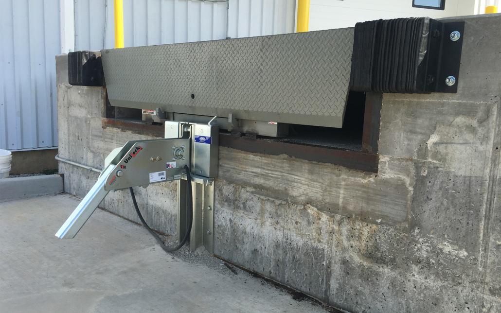 Industrial dock leveler for efficient loading at Kodiak Equipment Services.
