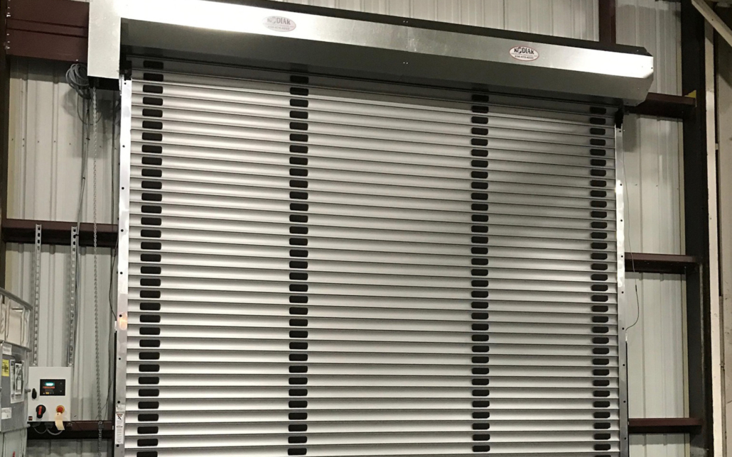 Heavy-duty industrial roll-up door for warehouse and manufacturing facilities.