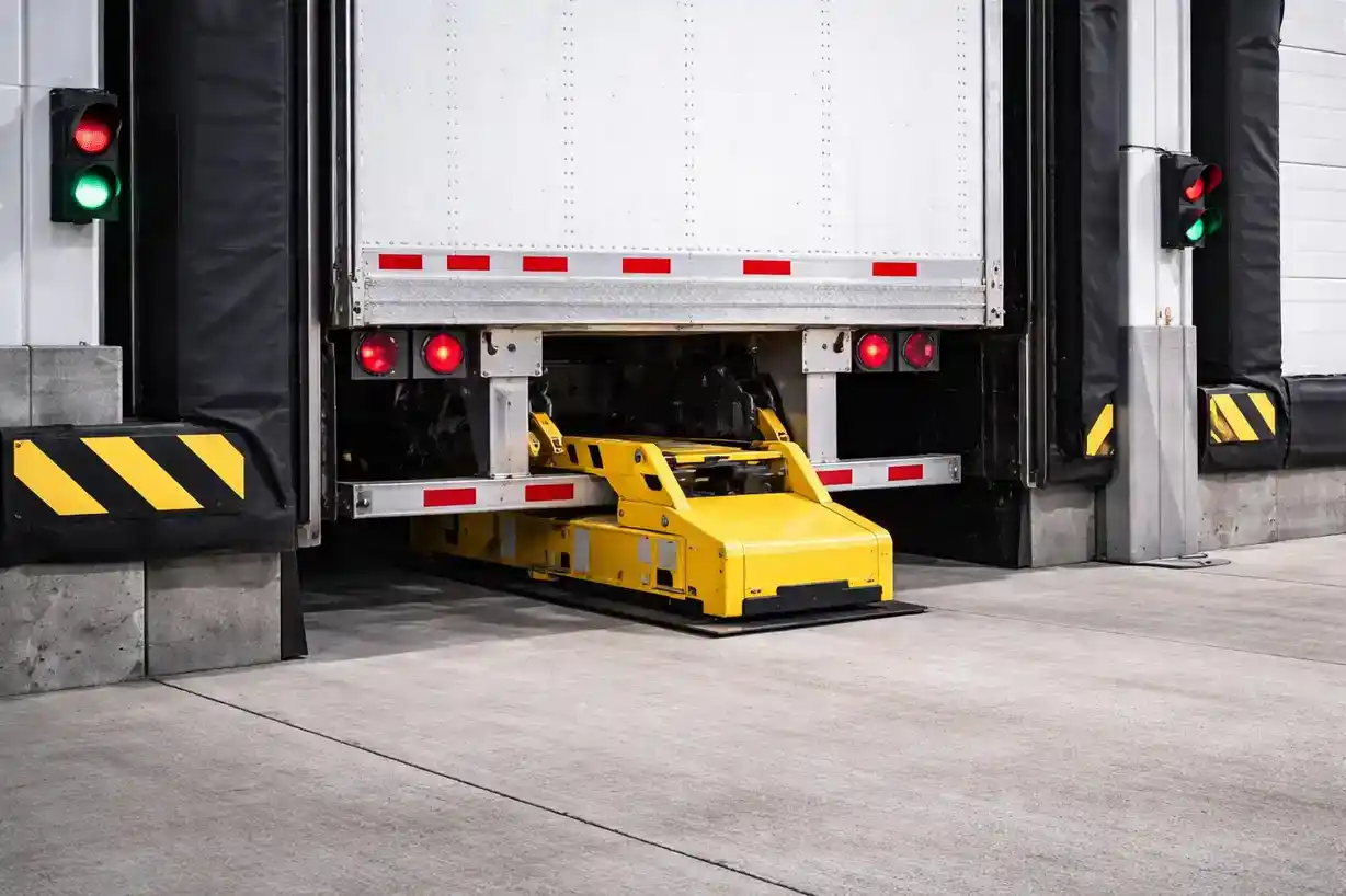 Loading dock with vehicle restraint system for safety and security.